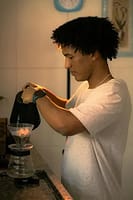 Homemade pour over coffee on kitchen counter next to bag of ground coffee