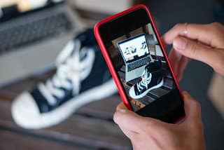 person photographing items to sell online as side hustle