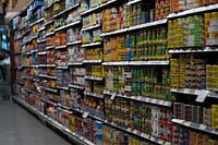 Grocery aisle showing store brand products next to name brand versions