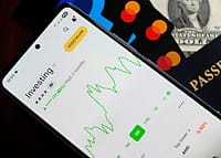 Person looking at investment app on phone for the first time as a beginner