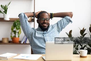 Happy man feeling relief after successfully cutting down his monthly expenses