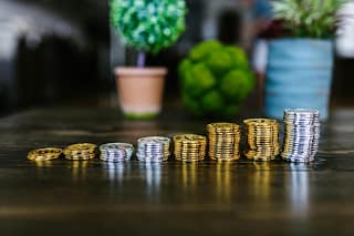 Small consistent investments growing into wealth little by little over time