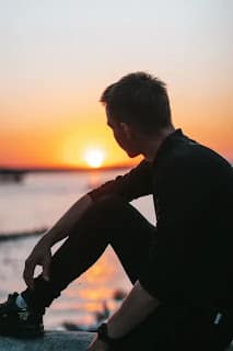 person looking calm and hopeful about the future sitting outside