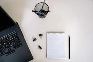 simple notebook and pen replacing complicated budgeting apps