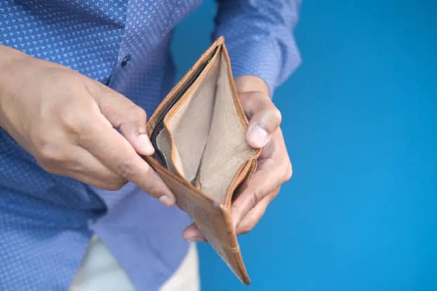 The Real Reason You Cannot Save Money why you cannot save money - person holding empty wallet with no cash