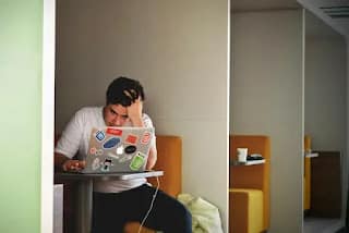 person overwhelmed by budgeting app notifications and categories